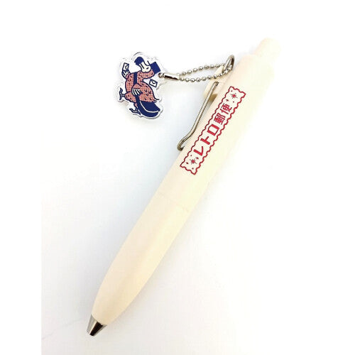 Pen with a character charm on a white background